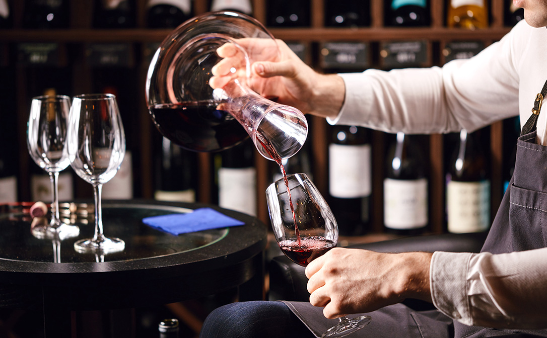 Sommelier decanting wine