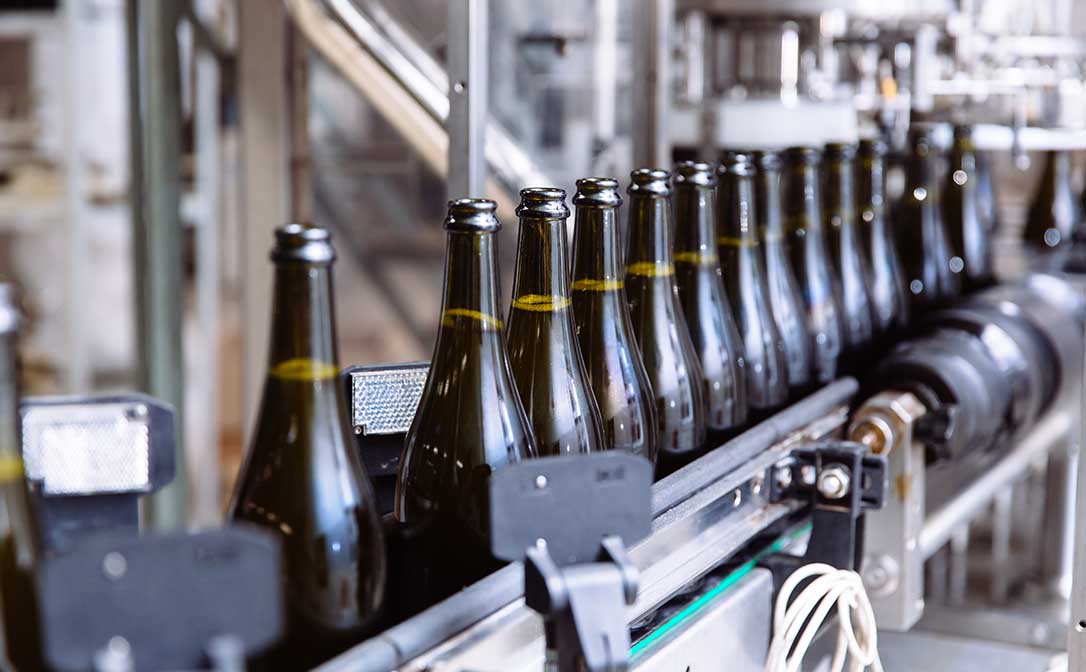 Wine bottles on an automatic conveyor