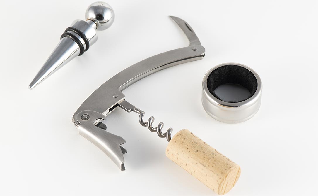 Waiter's Friend corkscrew with a cork on the screw, with a dropstop and a bottle stop.